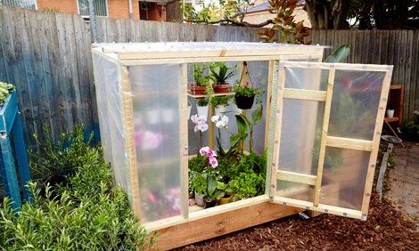 A Gardening Cart with Hanging Space | Build a beautiful outdoor greenhouse | Creative Greenhouse DIY plans Serre Diy, Homemade Greenhouse, Cheap Greenhouse, Modern Greenhouses, Diy Greenhouse Plans, Best Greenhouse, Outdoor Greenhouse, Build A Greenhouse, Indoor Greenhouse