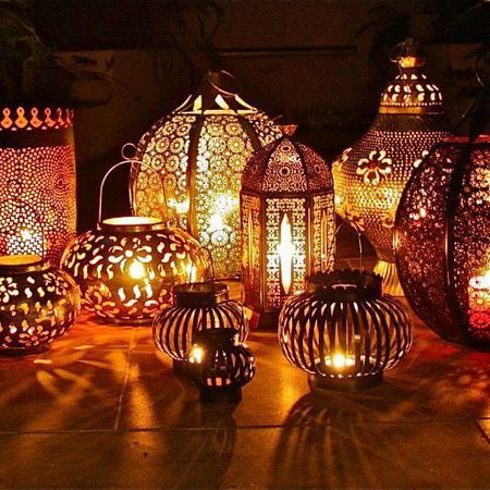 Dot these Moroccan lanterns around outside for that balmy summer evening feel… … Lots Of Candles Decor, Arabian Wedding, Moroccan Garden, Moroccan Party, Moroccan Theme, Candle Decoration, Mehndi Decor, Wedding Lighting, London Garden