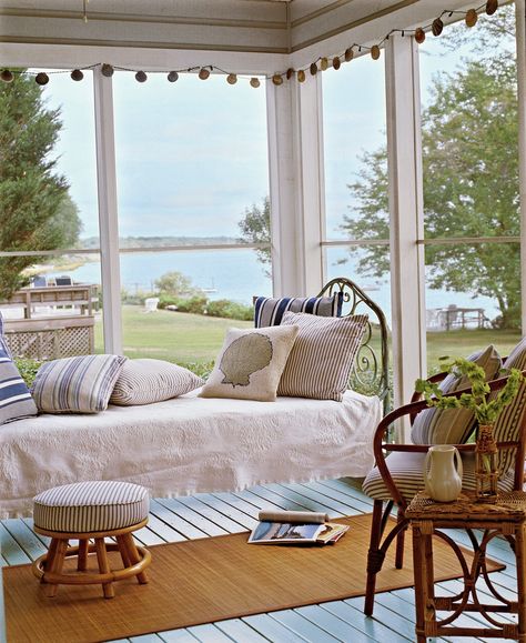 What’s better than a porch by the sea? One outfitted with a hanging bed that’s perfect for sleeping or soaking up a beach read. #porchdecorating #porchideas #frontporchdecor #sleepingporch #southernliving Comfy Cottage, Cottage Rooms, Light Blue Bedding, Antique Iron Beds, Porch Bed, Porch Design Ideas, Cottage Coastal, Cottage Room, Hanging Beds