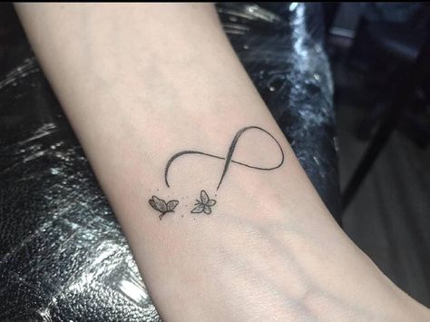 Butterfly And Infinity Tattoo, Infinity Tattoo With Butterfly, Infinity Butterfly Tattoo For Women, Tattoos For Women Small Wrist, Women Wrist Tattoos, Tattoos For Women Wrist, Infinity Butterfly Tattoo, Caroline Tattoo, Pearl Jam Tattoo