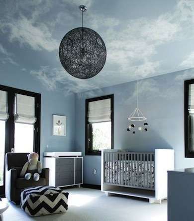 In the Clouds The extreme angles of dormered ceilings can make a room feel tight, but painted clouds on the ceiling and upper walls softened the edges for an airy look. The white clouds add a feeling of expansiveness to a simple and clean blue-and-black room. Baby Boy Room Nursery, Nursery Room Boy, Blue Nursery, Baby Bedroom, Baby's Room, Baby Boy Rooms, Nursery Design, Contemporary Bedroom, Baby Boy Nurseries