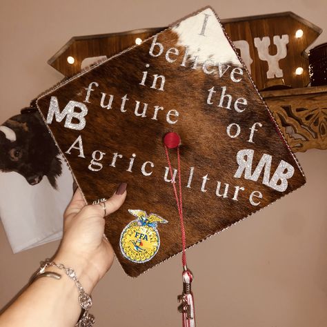 My high school graduation cap featuring the opening line to the FFA creed and my brand and my family’s brand.❤️ Ag Teacher Graduation Cap, Cowhide Graduation Cap, Agriculture Graduation Cap Ideas, Ag Graduation Cap, Agriculture Graduation Cap, Ffa Graduation Cap, 2026 Senior, Ffa Creed, Teacher Graduation Cap