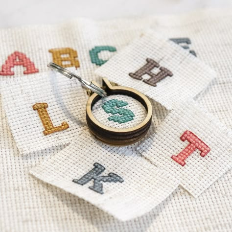 Cross Stitch Initials Letters, Cross Stitch Hoop Ideas, Cross Stitch Keychain Diy, Keychain Cross Stitch, Cross Stitch Keychain Pattern, Cross Stitch Letters Small, Tiny Christmas Cross Stitch, Mini Cross Stitch Patterns Miniatures, Small Cross Stitch Patterns Free Minis