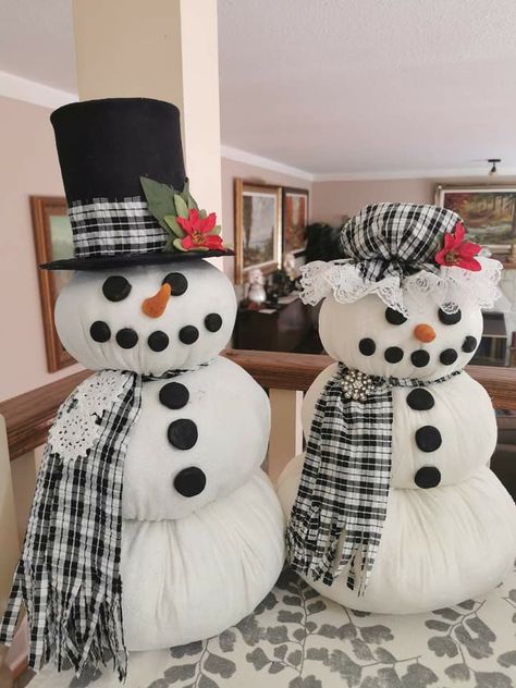 Made a Mr & Mrs Snowman I absolutely love them. No arms yet looking for the right sticks.  What do you think. Update  I've had a lot of you ask how I did I'd. Here's the instructions:.  Full circles are 18" 15" & 12" I put a small bag of rocks in the bottom and a wooden dowel then stuffed each circle until I couldn't stuff anymore. The  boys hat  is a large can of tomatoes with cardboard on the bottom. Girls hat I believe is a 12" circle I sewed lace around the edge then did a running stitch abo Mrs Snowman, Boys Hat, Diy Snowman, How To Make Snow, Gnomes Crafts, Holiday Crafts Christmas, Snowman Crafts, Snowman Ornaments, Christmas Wall Decor