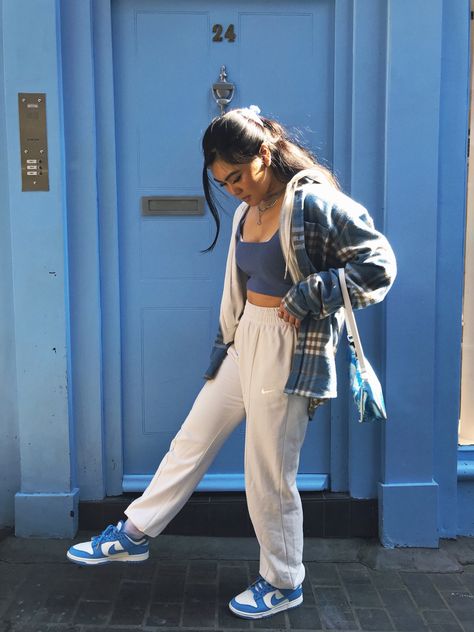 Blue dunks / sneakers / trainers / nike joggers / crop top / blue door / shoulder bag / baguette bag / white zip up / claw clip / streetwear Light Blue Dunks Outfit, Dunks Nike Outfit, Nike Dunk Blue Outfit, Polar Blue Dunks Outfit, Blue Nike Dunks Outfit, Blue Dunks Outfit, Dunks Sneakers, Blue Dunks, Nike Dunk Outfit