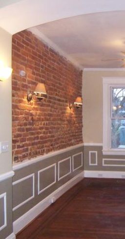 Exposed brick with crown moulding. Exposed Brick With Panelling, Partial Brick Wall Interior, Brick And Wainscotting Wall, Playroom Nook, Exposed Brick Interior, Brick Wall Bedroom, Brick Wall Living Room, Industrial Ideas, Wainscoting Wall