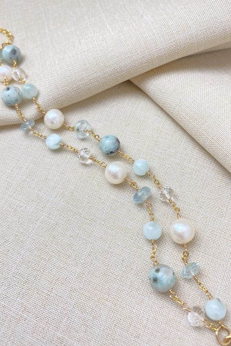 This gorgeous bracelet features two delicate gold beaded chains adorned with beautiful mint green jasper, aquamarine, and freshwater pearls. Its soft and feminine design adds a touch of elegance to any outfit. It is perfect for layering or wearing alone for a subtle pop of color. Gold filled Length: 7-8 inches adjustable with lobster clasp and 1-inch extender Gemstones: mint green jasper, aquamarine, cultured freshwater pearls, green moonstone, crystal quartz Gift box included. Free shipping on US orders 30 day free returns Our artisan gemstone beaded jewelry for women is crafted using hand-selected gems and pearls. Every design is handmade in America, handcrafted by the designer in her home studio in Richmond Hill, GA. Green Moonstone, Pale Mint Green, Layered Bracelet, Gemstone Beads Jewelry, Green Jasper, Richmond Hill, Handmade Jewelry Tutorials, Silver Jewelry Necklace, Moonstone Crystal