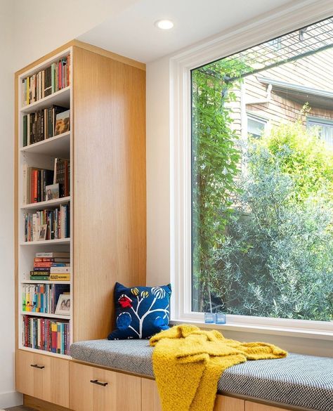 Don't you just love a picture window 🤩 . This is the perfect reading nook set in bellmont rift white oak, nestled inside our newest ADU. A perfect corner for those light rains on a spring day. 🌸🌿⁠ ⁠ ⁠ #readingnook #adu #design #inspiration #homeremodel Window Side Sitting In Bedroom, Reading Bench With Bookshelves, Bookshelf With Seating, Reading Corner By Window, Reading Window Nook, Modern Window Seat, Reading Nook Window, Builtin Bookshelves, Minimalist Bookshelves