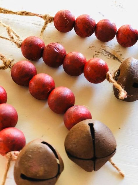 very simple painted wooden bead and rustic bell Christmas ornaments can be DIYed easily and look cool Wood Bead Christmas Ornaments, Wood Bead Ornaments, Bead Christmas Ornaments, Wood Bead Christmas, Deco Noel Nature, Organic Christmas, Christmas Beads, Wood Beads Diy, Bead Ornaments