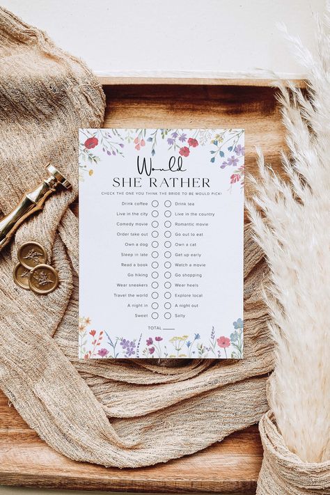 "Would She Rather Bridal Shower Game Template Have fun with your guests at your bridal shower by playing this would she rather bridal shower game template. This wildflower would she rather game will perfectly match your boho bridal shower, floral bridal shower or boho baby shower! ⸻ MATCHING BRIDAL SHOWER GAMES BUNDLE https://etsy.me/3uBIeeR ⸻ This is a DIGITAL DOWNLOAD editable template - no physical products will be shipped. After purchase, an email with a link to your template will be sent to you within minutes. You'll edit using Templett's online app in your web browser. ⸻ ✨ FREE DEMO - TRY BEFORE YOU BUY ✨ Copy and paste the link below into your browser: http://templett.com/design/demo/bellabooprintables/25294777 ⸻ WHAT'S INCLUDED * 5\" x 7\" Would She Rather Game Template ⸻ MATCHING Floral Boho Bridal Shower Ideas, Love Is In Bloom Bridal Shower Games, Boho Bridal Shower Ideas Decor, Bridal Shower Wildflower Theme, Wildly In Love Bridal Shower Theme, Love In Bloom Bridal Shower Ideas, Wild Flower Bridal Shower Ideas, Spring Bridal Showers, Wildflower Bridal Shower Theme