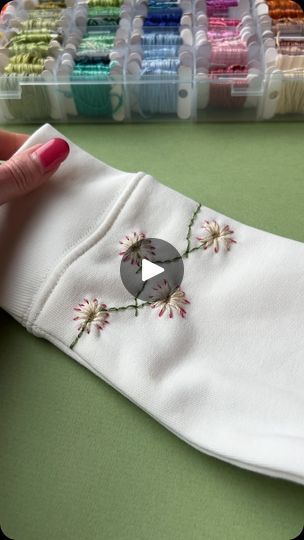 1.7M views · 41K reactions | Daisy Chain Cuffs
.
.
#upcycledclothing 
#upcycledfashion 
#embroideredflowers 
#embroideredclothing 
#embroidereddenim 
#embroideredclothes 
#embroideredflorals 
#learntoembroider 
#mindfulart 
#slowstitching 
#sewingproject 
#embroiderypatterns 
#bordadolivre 
#createdtocreate 
#diycrafts 
#slowcraft 
#dmcthreads 
#dmcembroidery 
#springflowers 
#embroiderydesign 
#beginnerembroidery 
#embroiderywork 
#denimembroidery 
#sustainablefashion 
#embroiderhappyhoops 
#embroiderytutorial 
#embroideryprocess 
#embroideryproject 
#handsew | Jenny ~ Embroidery Art, Design & Crafts | Art Music · July Embroidery Daisy, Clothes Embroidery, Learning To Embroider, Denim Embroidery, Clothing Diy, Diy Embroidery Patterns, Embroidery Letters, Embroidery On Clothes, Slow Stitching