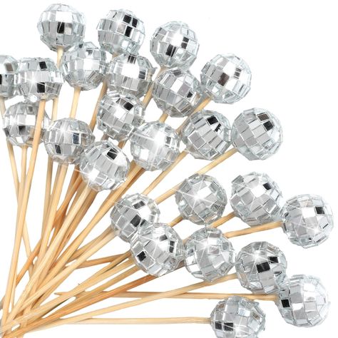 PRICES MAY VARY. Package Content: you will get a package of 100 disco ball cocktail picks for appetizers, which can easily pierce through food, this ensures you have enough to accommodate large gatherings or parties, the quantity also allows for frequent use without worrying about running out quickly Aesthetic and Shiny Design: what makes these cocktail skewers stand out is their exquisite shiny design, each pick comes with a small disco ball that reflects light in a pleasing way, adding a touch Disco Themed Party Accessories, Disco Ball New Year Party, Disco Ball Cocktail, Appetizer Skewers, Toothpick Appetizers, Food Garnish, Skewer Appetizers, Disco Decorations, Cocktail Sticks