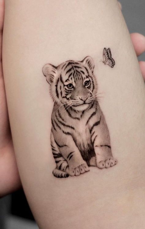 best tiger tattoos 2023 Tiger Cub Tattoo, Tiger Tattoo Small, Tiger Tattoo Meaning, Lion Cub Tattoo, White Tiger Tattoo, Cub Tattoo, Pixie Tattoo, Owl Tattoo Drawings, Kitten Tattoo