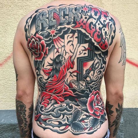 Rock Of Ages back piece tattoo done by @uptown_danny | www.otzi.app Traditional Backpiece, Austria Tattoo, Tattoo Traditional Flash, Rock Of Ages Tattoo, Traditional Chest, Traditional Black Tattoo, Sailor Tattoos, Peacock Tattoo, Realistic Tattoo Sleeve