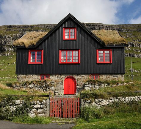 Black house, red windows, grass roof - the stereotypical Faroese building. This one is located near the old cathedral, SW of Tórshavn, Faroe Islands. Black Siding, Cabin Colors, Red Windows, Grass Roof, Kingdom Of Denmark, Black Houses, Front Facade, Green Roofs, Cozy Cabins