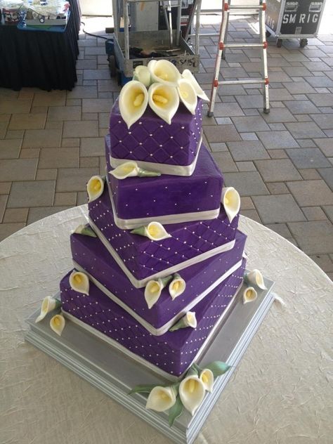 - Purple buttercream with gumpaste calla lilies.  Offset squares. Wedding Cake Designs Purple, Lily Wedding Cake, Wedding Cake Purple, Calla Lily Wedding Cake, Purple Calla Lily, Cake Varieties, Cake Purple, Purple Wedding Cake, Purple Cake