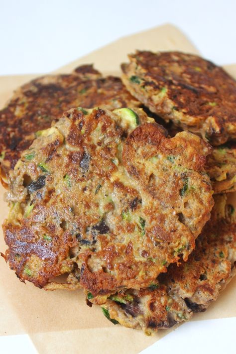 These Eggplant Zucchini Fritters are such a great toddler food. Really anyone in the family can enjoy. They are so flavorful and packed in nutrients. They\'re loaded with eggplant, zucchini, mushrooms, spices and herbs. You have never had a veggie fritter quite like these! Blw Eggplant, Eggplant Patties, Eggplant Fritters, Side Veggies, Eggplant Benefits, Vegetable Patties, Zucchini Health Benefits, Zucchini Mushrooms, Veggie Options