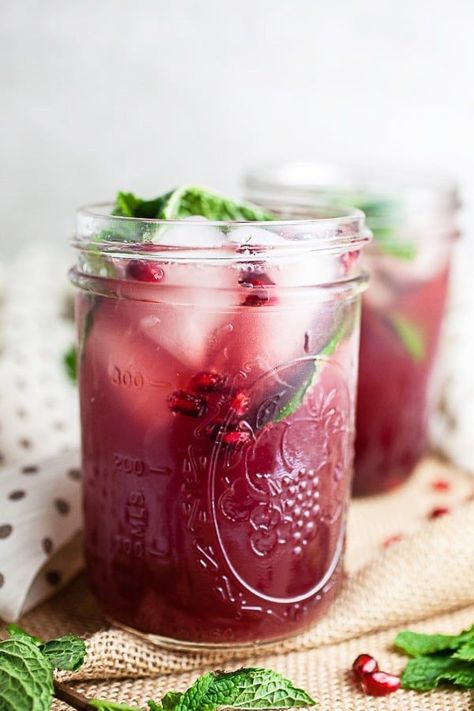 This Pomegranate Mojito Cocktail recipe is one of my favorite holiday cocktails! It's perfect for Christmas and New Year's Eve parties. It's made with rum, lime, and fresh mint. This festive drink is easy to prepare. Leave out the rum for a great mocktail version! Pomegranate Mojito, Pomegranate Cocktails, Mojito Cocktail, Cocktail Serving, Mojito Recipe, Festive Cocktails, Festive Drinks, Easy Cocktails, Drinks Alcohol Recipes