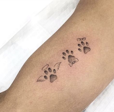 Paw Print Spine Tattoo, Dog Memorial Tattoo Ideas, Tattoos For Dogs That Passed, Katt Grejer, Pawprint Tattoo, Dog Memorial Tattoos, Dog Paw Tattoo, Cross Tattoos For Women, Feather Tattoo Design