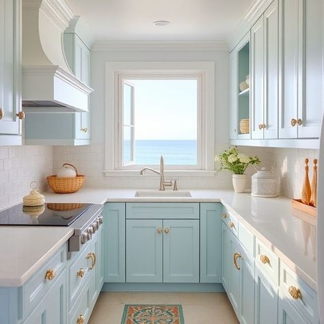 Coastal-themed kitchen with nautical decor, light blue and white colors, rope handles, shell-shaped cabinet knobs, and ocean-inspired artwork. Beautiful Kitchen Designs, Decor Elements, Beautiful Kitchen, Kitchen Design Ideas, Kitchen Themes, White Colors, Rope Handles, Ocean Inspiration, Beautiful Kitchens