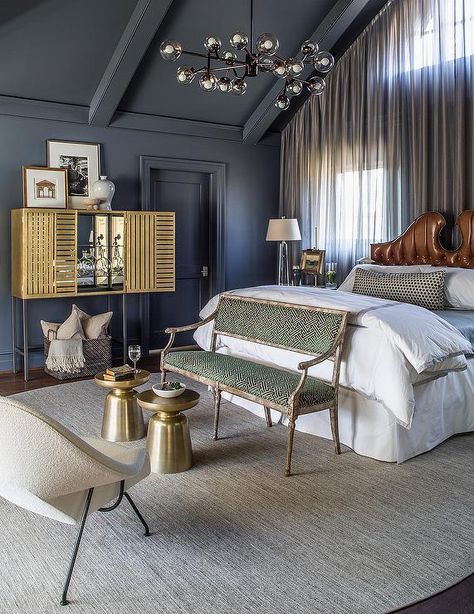 Dark+gray+bedroom+features+a+vaulted+ceiling+and+a+modular+chandelier+illuminating+a+brown+leather+tufted+headboard+in+bed+dressed+in+white+and+gray+hotel+bedding,+placed+in+front+of+windows+dressed+in+gray+sheer+curtains. Vaulted Ceiling Bedroom, Grey And Gold Bedroom, Dark Gray Bedroom, Dark Bedroom Furniture, Curtains Design, Bedroom Gray, Grey Ceiling, Grey Wall Decor, Grey Bedroom Furniture