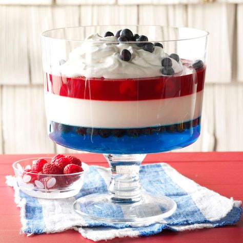 Red, White 'n' Blue Salad Recipe from Taste of Home | The shimmering stripes are formed with distinctive gelatin layers. It makes you want to salute before spooning some up! Recipes For 4th Of July, Jello Salad Recipes, 4th Of July Jello, Memorial Day Desserts, Gelatin Salad, Blue Salad, Blue Jello, Patriotic Desserts, Trifle Dish