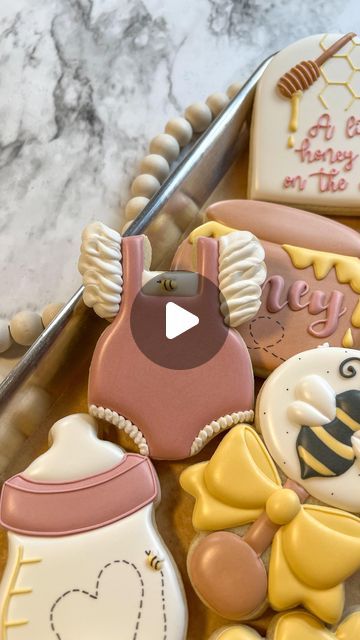 Breanna Deeds on Instagram: "A baby outfit or baby rattle are two of my most favorite cookies to decorate 😍  #customcookies #decoratedcookies #cookiesofinstagram #cookieart #edibleart #babyshowercookies #alittlehoneyisonthewaycookies #whatwillbabybeecookies #sweetascanbeecookies #beecookies #cookiedecoratingvideos #oddlysatisfying #satisfyingvideos" Baby Rattle Cookies, Winnie The Pooh Cookies, Cookies To Decorate, Onesie Cookies, Bee Cookies, Cookie Inspiration, Baby Shower Cookies, Oddly Satisfying, Cookie Art