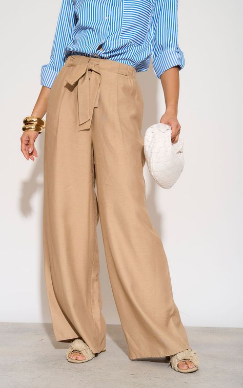 Elevate your wardrobe with our high waist wide leg trousers in beige, featuring an elastic belt on the waist for the perfect fit and convenient pockets for added functionality. These wide trousers boast a luxurious feel and offer unparalleled comfort with their relaxed yet flattering fit. Available in a range of chic colors, these trousers are a versatile addition to any ensemble. Pair with:  1. Classic chic: style these trousers with a crisp white blouse and statement heels for a polished and s Drawstring Pants Outfit Work, Wide Leg Trousers Outfit, Outfits Hot, High Waist Wide Leg Trousers, Classic Chic Style, Trousers With Belt, Hot Season, Crisp White Blouse, Statement Heels