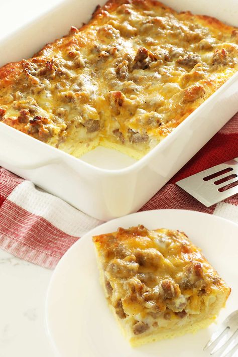 Sausage, egg and cheese breakfast casserole with biscuits. A hearty breakfast that is easy to make and perfect for holidays, brunch and potlucks. Biscuit Breakfast Casserole, Casserole With Biscuits, Biscuit Breakfast, Breakfast Casserole With Biscuits, Eggs And Cheese, Breakfast Casserole Easy, Hash Browns, Breakfast Snacks, Easy Casserole Recipes