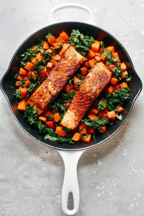 This Spicy Salmon Sweet Potato Skillet recipe features perfectly seasoned and crispy salmon that is a great partner for the sweet potato and milted kale. Sweet Potato Skillet Recipes, Healthy Skillet Meals, Salmon Sweet Potato, Potato Skillet, Salmon And Sweet Potato, Sweet Potato Skillet, Garlic Butter Salmon, Sweet Potato Kale, Skillet Potatoes