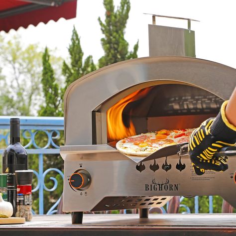 Savor the perfect pizza in just 60 seconds with the BIG HORN OUTDOORS Gas Pizza Oven. This high-performance culinary marvel boasts 23,000 BTU burners, achieving a blazing 662 ºF in 5-7 minutes and an incredible 1180 °F in just 60 seconds. Its innovative arc-shaped furnace chamber design maximizes heat circulation, ensuring every bite is delectably satisfying. Propane Pizza Oven, Italian Pizza Oven, Best Outdoor Pizza Oven, Gas Pizza Oven, Stainless Steel Bbq Grill, Crispy Pizza, Pizza Maker, Portable Grill, Outdoor Oven