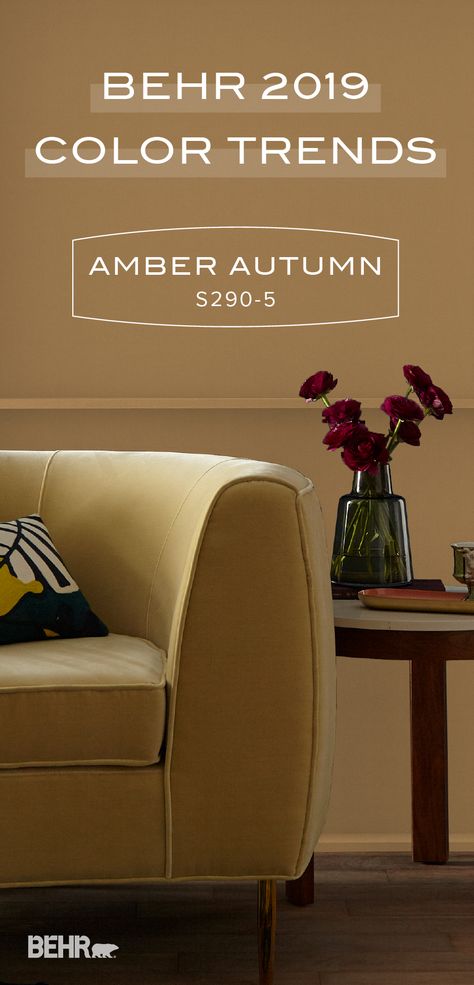 This fall, sink into the warm and cozy hue of Amber Autumn by Behr Paint. As part of the 2019 Color Trends collection, this trending shade pairs well with a variety of earthy paint colors. Use a paneled accent wall and a mid-century modern velvet couch to recreate the contemporary style of this living room in your home. Click below to discover more interior design inspiration. Earthy Paint Colors, Paneled Accent Wall, Dark Interior House, Beach House Interior Colors, Best Kitchen Wall Colors, Exterior Updates, Interior Paint Colors Schemes, Contemporary Style Kitchen, Color Of The Month