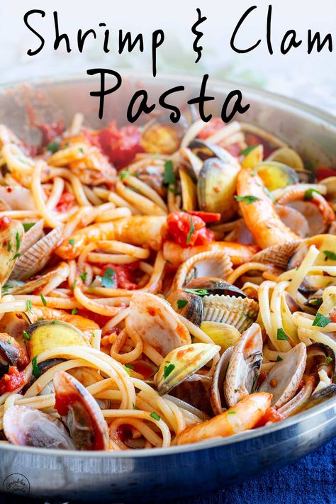 This Shrimp and Clam Pasta is easy to make and will have you feeling like a gourmet chef. The recipe pairs succulent shrimp and fresh clams with al dente pasta in a rich, tomato-based sauce. The result is a dish that is bursting with flavor. It's a classic Italian dish that is easy to make and flavorful. Serve it with plenty of bread to soak up the sauce, and you have a quality restaurant meal at home. Clams And Shrimp Pasta, Shrimp And Clam Pasta, Clam Recipes Pasta, Clam Recipes Fresh, Clams Pasta, Clam Pasta Recipe, Chickpea Feta Salad, Clams Recipe, Fresh Clams