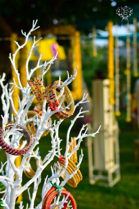 Photo of Bangles on painted branches for mehndi decor Mehndi Decoration Ideas At Home, Pastel Wedding Decorations, Bangle Ceremony, Painted Branches, Mehendi Decor, Indian Wedding Favors, Mehndi Night, Indian Wedding Planner, Wedding Reception Backdrop