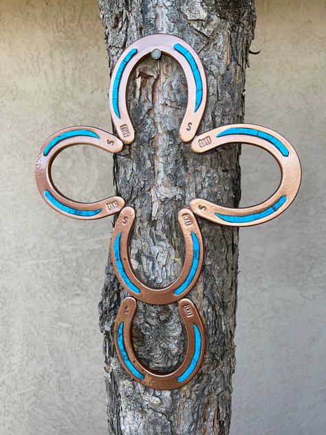 Handmade horseshoe Cross This southwestern look will go great in any room of your house. Painted with metallic hammered Copper finish. Placed in the middle of the shoes is Blue Turquoise. Will make a perfect gift. If any question please message. Thank you for Looking. Horseshoe Cross, Cross Ideas, Horseshoe Crafts Projects, Ranch House Decor, Welding Crafts, Horseshoe Projects, Western Crafts, Horseshoe Decor, Horseshoe Crafts