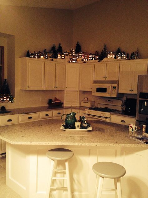 Christmas Village Above Cabinets, Christmas Village Above Kitchen Cabinets, Christmas Village On Top Of Cabinets, Snow Village Display Ideas, Diy Christmas Light Decorations, Future Christmas, Mini Village, Village Ideas, Above Kitchen Cabinets