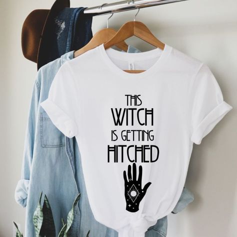 If you're a witchy bride, you'll love our This Witch is getting Hitched shirt! This ultra soft tee is perfect for celestial brides who are celebrating with a witchy and mystical touch! This shirt is great for any tarot card loving bride or for a witchy bridal shower theme!

✺ CHECK OUT more shirts/sweatshirts/hoodies/mugs like this in our BRIDAL/BACHELORETTE section: https://www.etsy.com/shop/SagiCrabBoutique?ref=seller-platform-mcnav§ion_id=38410678 ✺ Bride Tarot Card, Witchy Bride, Celestial Bride, Witch Wedding, Getting Hitched, Bride Shirt, Bride Shirts, Bridal Shower Theme, Running Tops