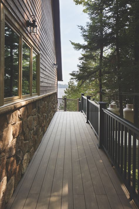 When durability is a key consideration for your outdoor living area, opt for TimberTech decking. Choosing hard-wearing materials – like PVC or composite decking – ensures you'll get to spend more time enjoying your deck and less time maintaining it. Find the material that's right for you. Decking: Vintage Collection - Dark Hickory Railing: Classic Composite Series - Premier Rail - Black Decking Inspiration, Deck Material, Timbertech Decking, Decking Options, Azek Decking, Deck Maintenance, Pvc Decking, Beautiful Outdoor Living Spaces, Deck Paint