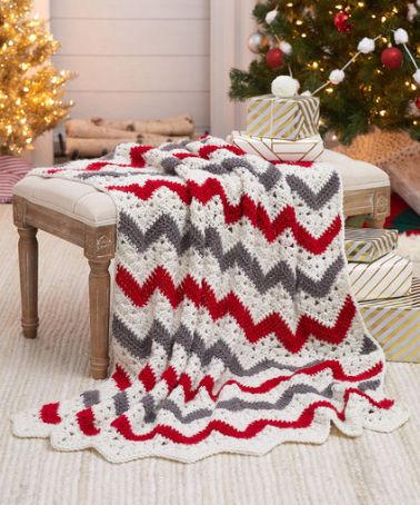 This stunning Red Heart Holiday Ripple Throw Crochet Pattern will be your new favorite one to hook for those nights of Netflix and chilling this winter. Turkey Roast, Ripple Crochet, Christmas Afghan, Holiday Crochet Patterns, Christmas Crochet Blanket, Throw Crochet, Crochet Ripple Blanket, Crocheted Afghans, Crochet Afghan Patterns Free