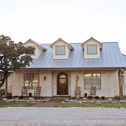 “glass,and limestone veneered walls. The roof is galvalume standing seam with three dormers. It offers a very comfortable and inviting appearance to country living. Rebecca McCoy Photography” “white limestone. It is very common around the Texas Hill Country area. My local supplier is Hill Country Stone (830)895-1366. The sizes are 4, 6, and 8 mix.” “The stone is a chopped white limestone.” Limestone House, Farmhouse Style Exterior, Austin Stone, Ranch House Remodel, Hill Country Homes, Building A Porch, Home Exterior Makeover, Exterior Makeover, Traditional Exterior