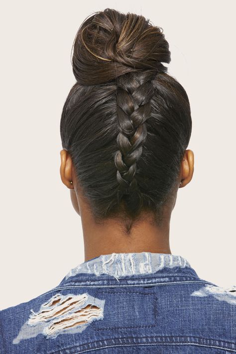 Up your top knot game with a back braid! Flip hair upside down and French braid the lower half of your hair in the back toward your crown, leaving out the front section. Once you reach the top of your head, gather the ends and the loose hair in front into a high pony. Secure with an elastic, then pin into a bun.   - Seventeen.com French Braid Top Knot, Braid In The Back Of Head, Comp Hairstyles, Homecoming Hairstyle, Communion Hair, New Braided Hairstyles, Braid Game, Upside Down Braid, Medium Hair Braids