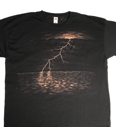 Lightning bolt at sea handpainted with bleach on a black T-shirt. Painted on the Fruit of the loom Original T.  Their T-shirts run slightly smaller so pick a size bigger than you would normally go for when buying from other brands. The sizes are S 35/37", M 38/40", L 41/43", XL 44/46", 2XL 47/49", 3XL 50/52" (measured all the way around the widest part of your chest in inches). I've also included their product specifications in the photos (measured in cm across the front of the shirt when it's l Bleach Shirt Design Ideas, Bleach Shirt Design, T Shirt Art Painting, Bleach Spray Shirt, Bleached Clothing, Bleaching Clothes, Bleach Shirt Diy, Dramatic Art, Bleach Shirt