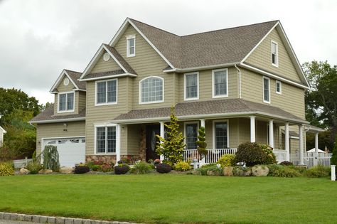 Brown green McMansion with white trim.  Like grey, this is a safe house exterior paint color. Olive Green House Exterior, Tan Houses, Olive Green House, Green Exterior House Colors, Green House Exterior, Exterior Siding Colors, Green Shutters, Sell My House Fast, Siding Colors