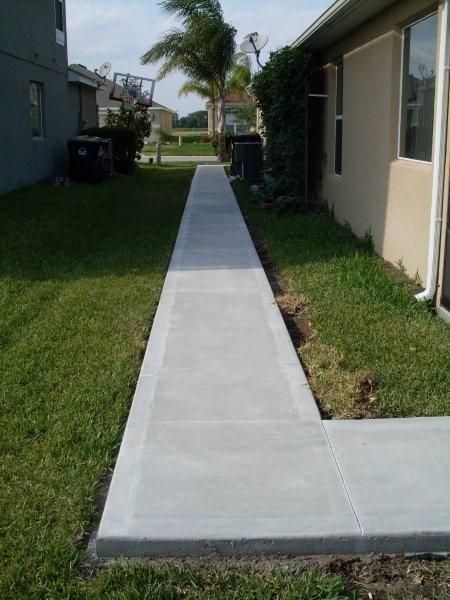 Concrete walkway done by Us Aluminum Services Path To Trash Can, Side Yard Concrete Walkway, Concrete Walkway Around House, Stepping Stone Walkways, Pavement Design, Concrete Path, Backyard Walkway, Concrete Patio Designs, Walkway Design