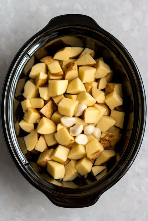 The BEST slow cooker mashed potatoes infused with garlic and made extra creamy thanks to a hint of sour cream or greek yogurt. This healthy, lightened up version will be your family's new favorite mashed potato recipe! #mashedpotatoes #slowcooker #thanksgiving #sidedish Mashed Potatoes Recipe With Milk, Mashed Potatoes Slow Cooker, Mashed Potatoes Sour Cream, Ultra Creamy Mashed Potatoes, Potatoes Slow Cooker, Slow Cooker Mashed Potatoes, Healthy Mashed Potatoes, Mashed Potato Recipe, Sweet Potato Recipes Mashed