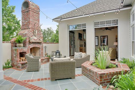 Red brick and a cream stucco. Brick Planters, Planters Patio, Red Brick Exteriors, Patio Images, Outdoor String Lights Patio, Outdoor Fireplace Designs, Outdoor Fireplace Patio, Patio String Lights, Patio Fireplace