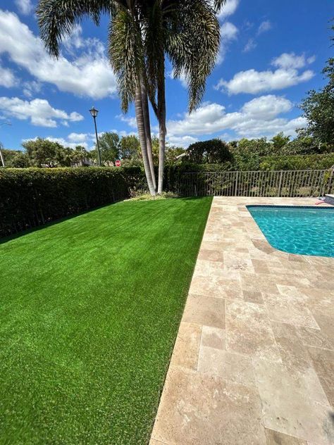 If the pile height is too short, the artificial grass will look fake. If the pile height is too tall, it will be difficult to walk on and obscure your pool. The best pile height for artificial grass around a pool is between ¾” and one inch Pool With Artificial Turf And Pavers, Pool Deck With Artificial Turf, Pool Artificial Turf, Artificial Turf Around Pool Swimming, Artificial Grass Pool Area, Astro Turf Around Pool, Artificial Turf Around Pool, Artificial Grass Around Pool, Artificial Turf Backyard