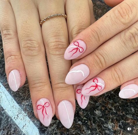 Holiday Bow Ribbon Nails! #cute #nails#trend #holiday #2024 Red Nails With Pink Bow, Acrylic Nail Designs Leopard Print, Pink Holiday Nails Almond, Cute Simple Xmas Nails, Pink Bow Nails Almond, Light Pink Nails Christmas, Bow Accent Nail, Easy Pink Christmas Nails, Pink And Red Bow Nails