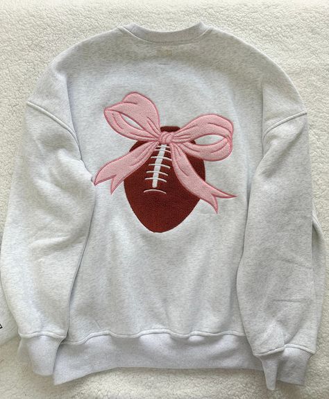 Details Brand: Sunkissed Coconut Solid Color Sweatshirt Cotton Blend Material Embroidered Small Football with Pink Bow on Front Embroidered Large Football with Pink Bow on Back Unisex Fit Crew Neckline Long Sleeves with Banded Cuffs Banded Bottom Hem Do Not Size up if you are smaller it will be to Big Do Size up if you want a Looser Fit or have a Large Chest Cut is Designed to be Larger in Mid Section but NOT Oversized Material 50% Cotton 50% Polyester Care Instructions Machine Wash Cold , Tumbl Sunkissed Coconut, Alchemy Jewelry, Umgee Clothing, Consuela Bags, Trendy Games, Patch Sweatshirt, Color Sweatshirt, 140 Lbs, Pearl Gray