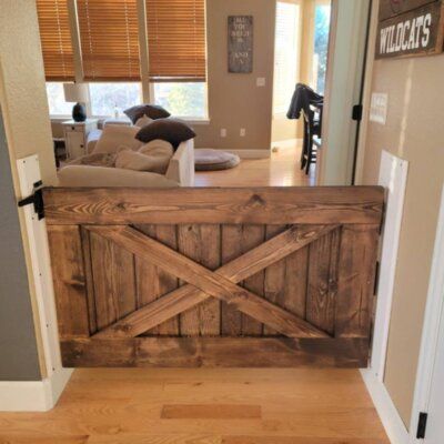 These handmade baby/pet gates come totally customizable. Hardware not included. Gates can come pained white, stained, or unfinished. | Stumps Custom Wood Paneled Wood Barn Door without Installation Hardware Kit Wood in Brown, Size 36.0 H x 36.0 W in | Wayfair Basement Stairway, Pet Gates, Wood Barn Door, Wood Barn, Basement Stairs, Inspire Me Home Decor, Western Homes, Barn Style House, Western Home Decor